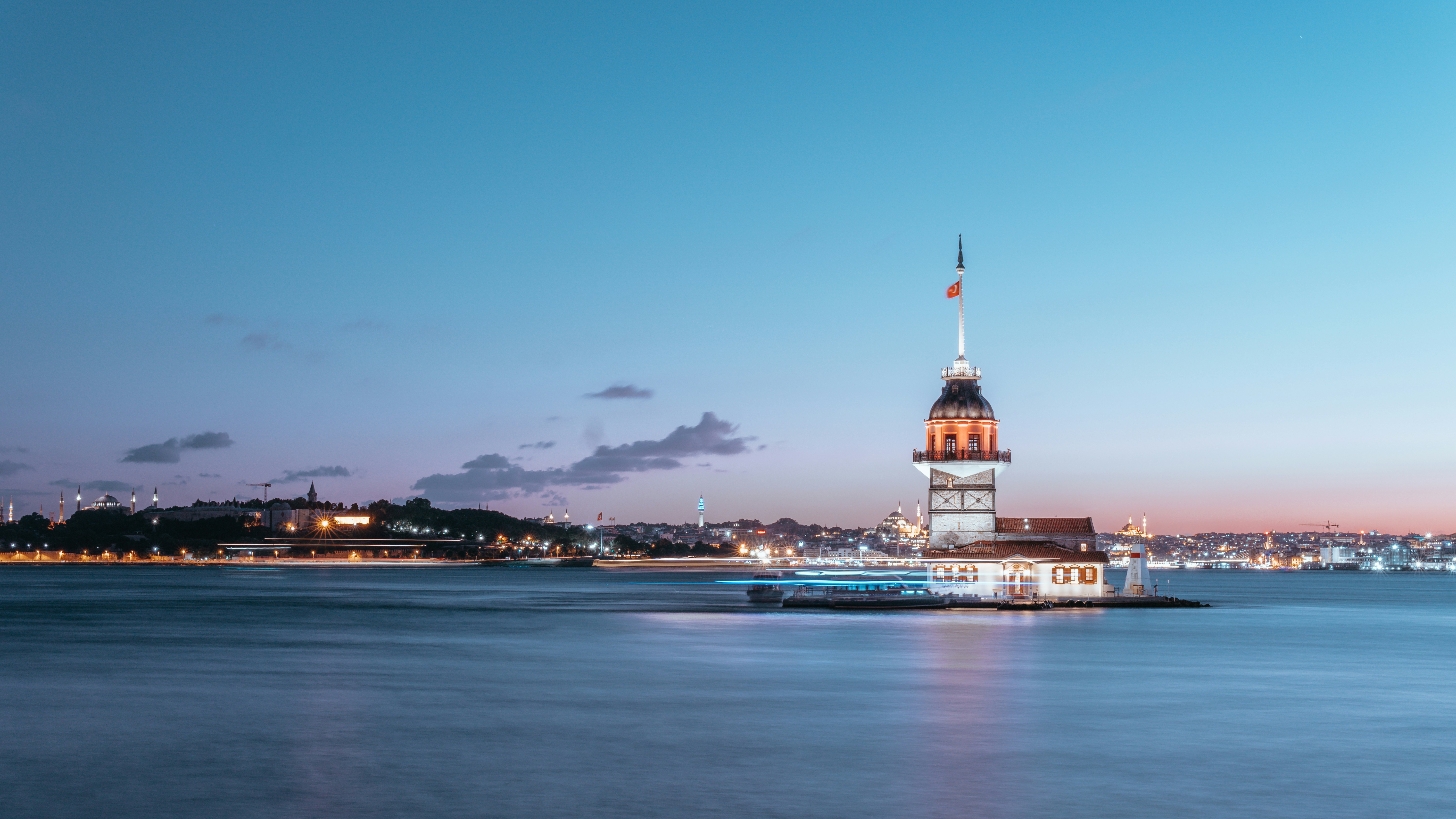 Stunning landscape view of a mountain range under a cloudy sky, representing global travel.